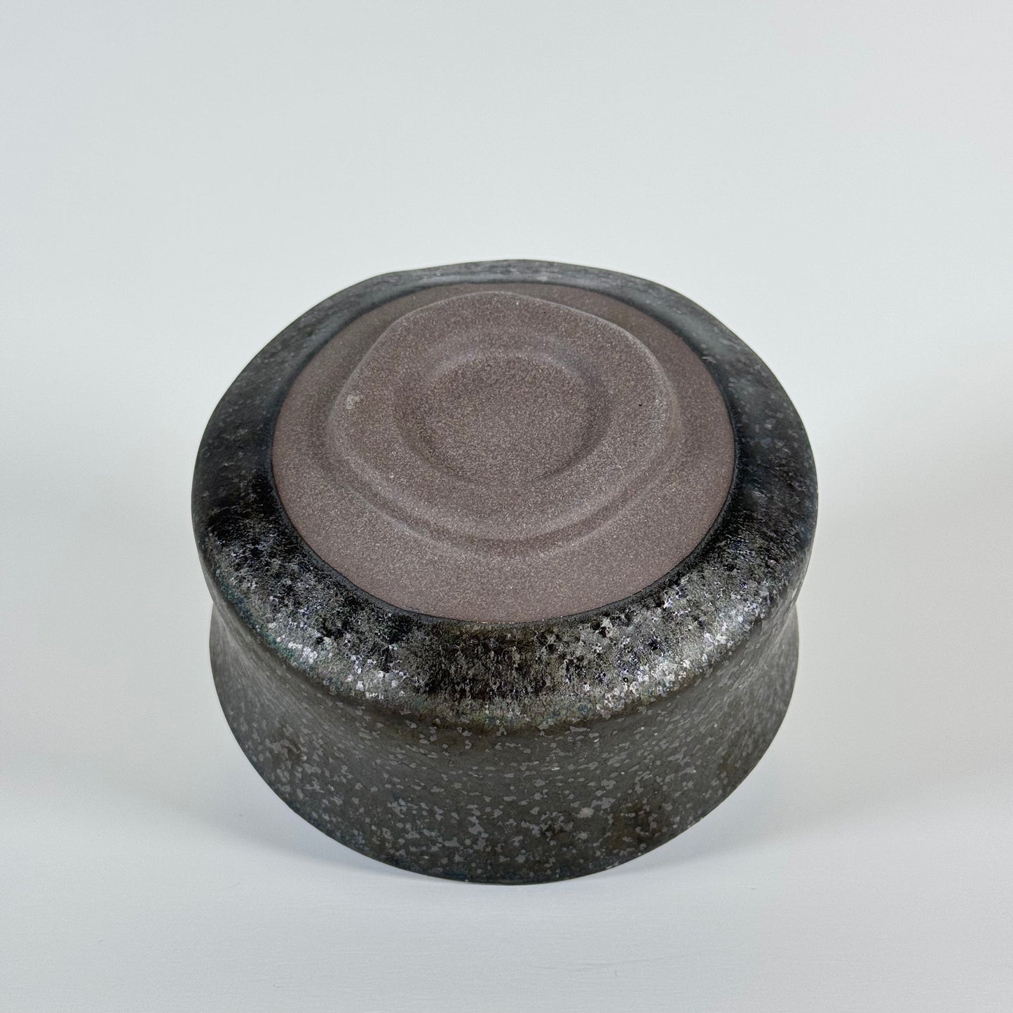 Base of handmade Midnight Wave ceramic matcha bowl showing traditional chawan foot ring