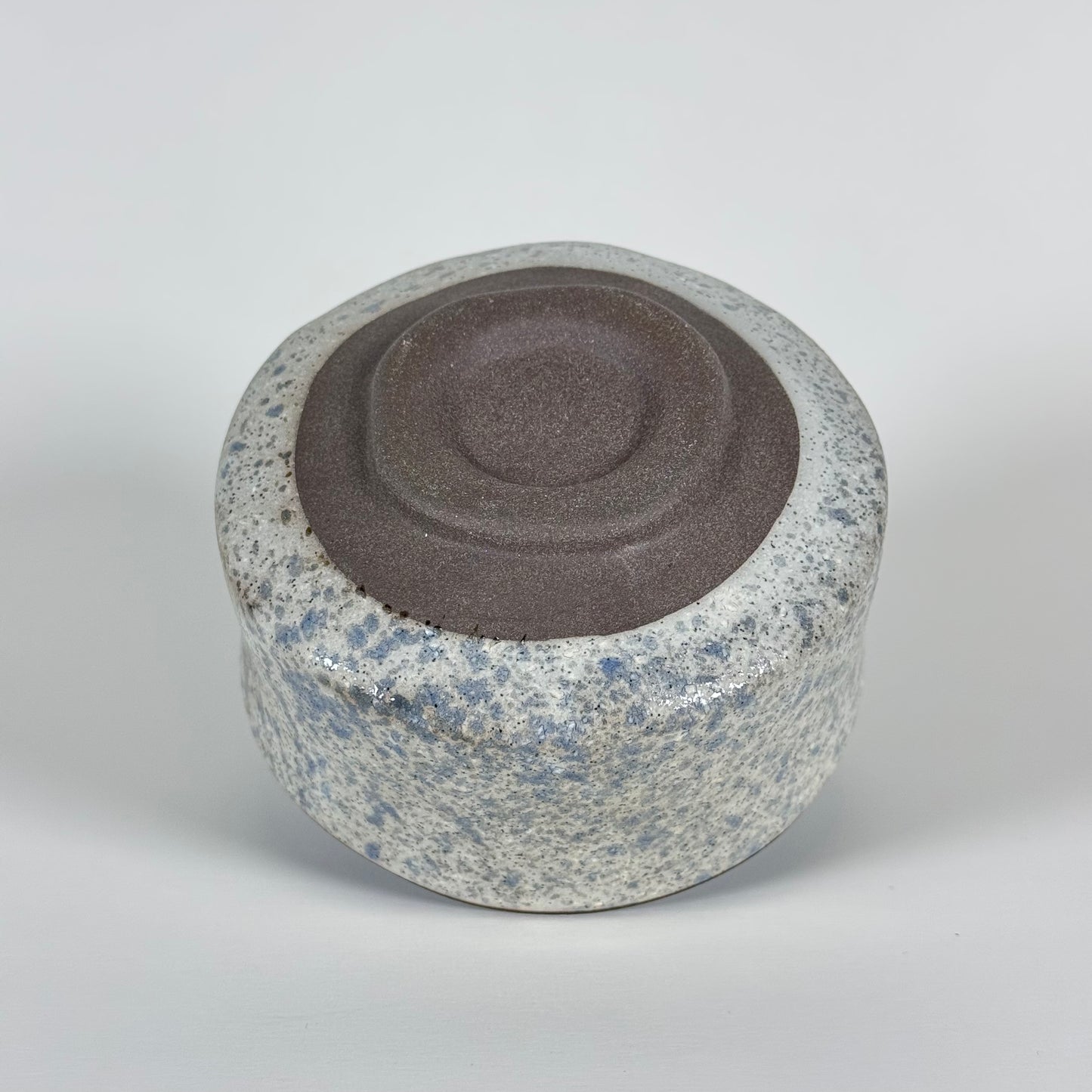 Base of handmade Stone Sky Japanese ceramic matcha bowl showing traditional foot ring