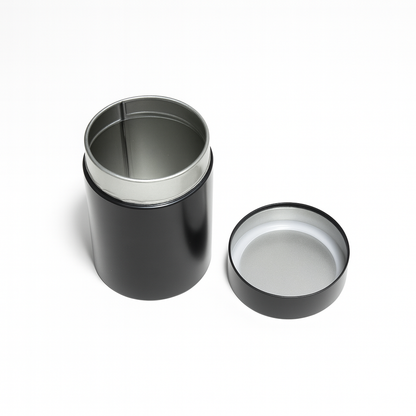 Interior of tea storage canister showing metal lining and inner lid for freshness protection