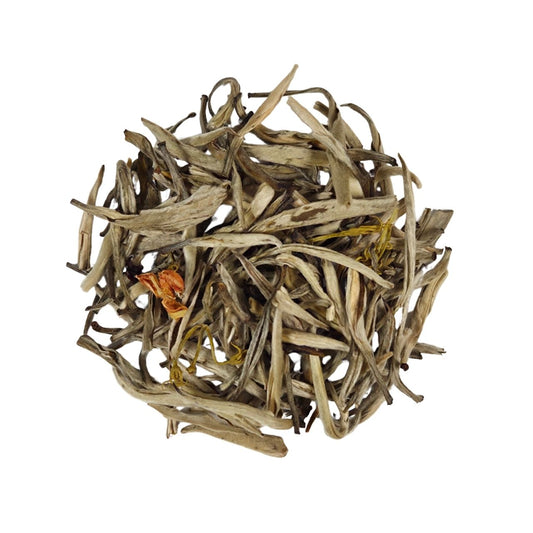 A pile of loose-leaf tea leaves, primarily light tan and beige with a small orange-yellow bud visible, isolated on a white background.