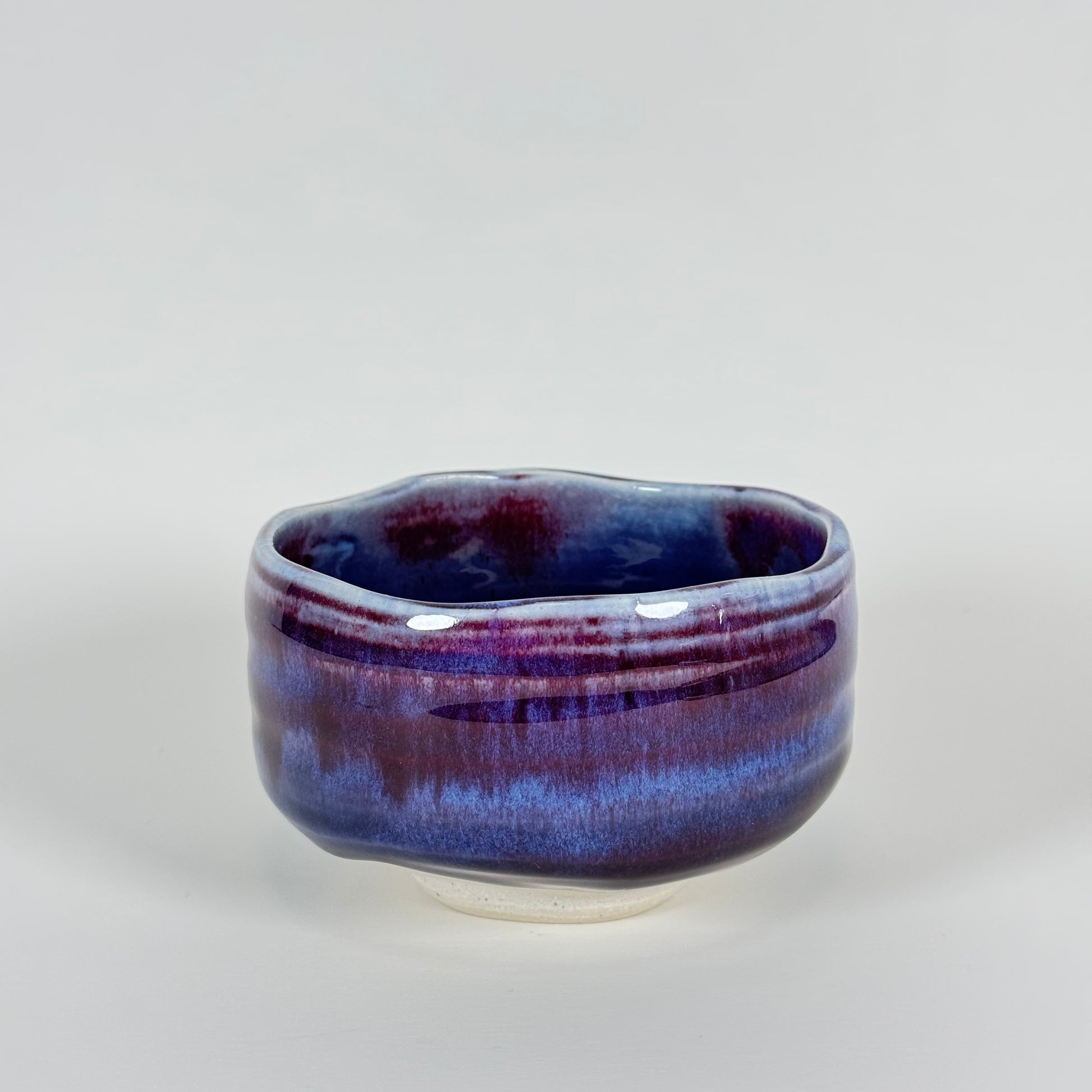Handmade Japanese amethyst haze chawan with purple and indigo glaze, front view