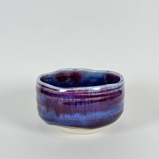 Handmade Japanese amethyst haze chawan with purple and indigo glaze, front view