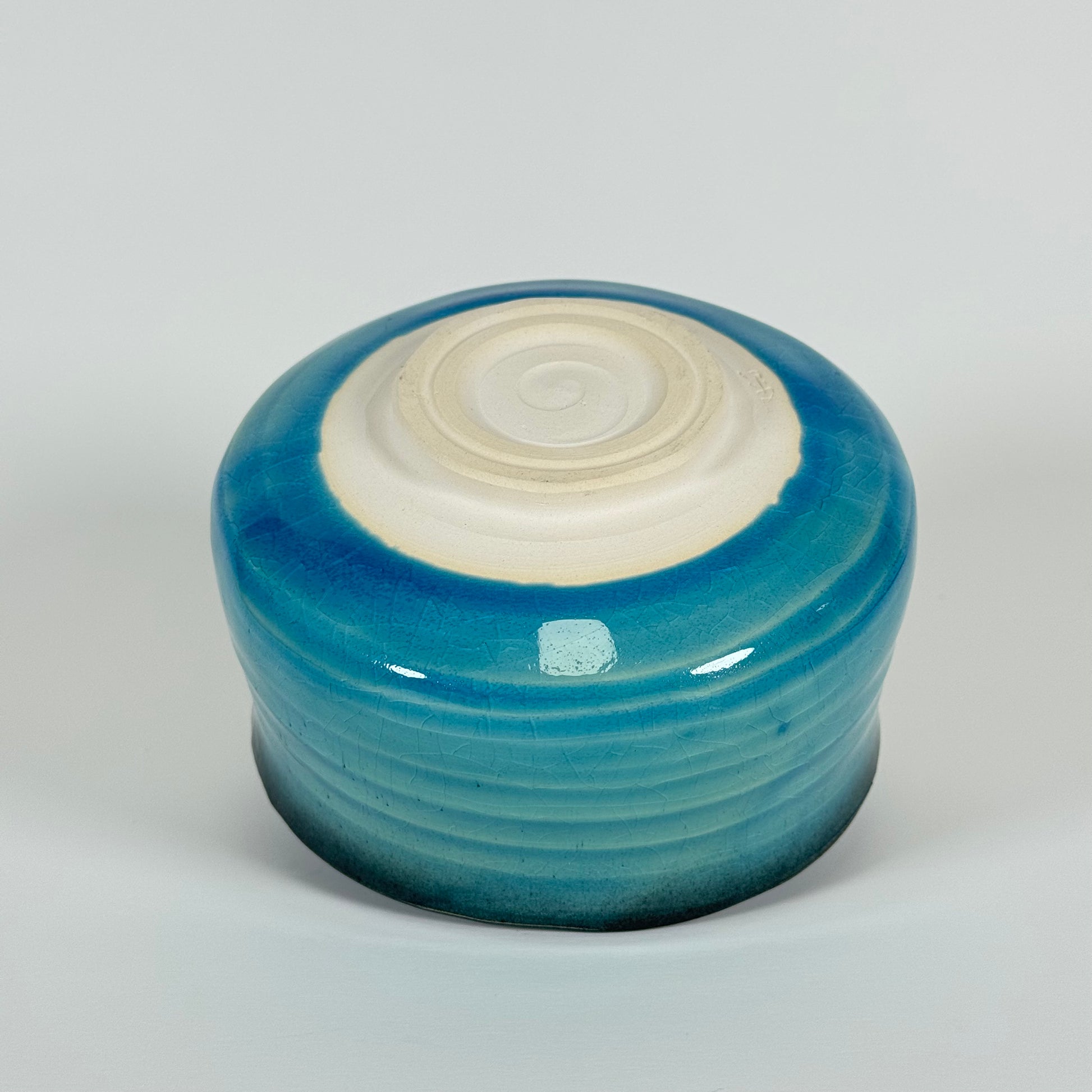 Detail of Azure Horizon matcha bowl showing blue gradient glaze and soft charcoal rim