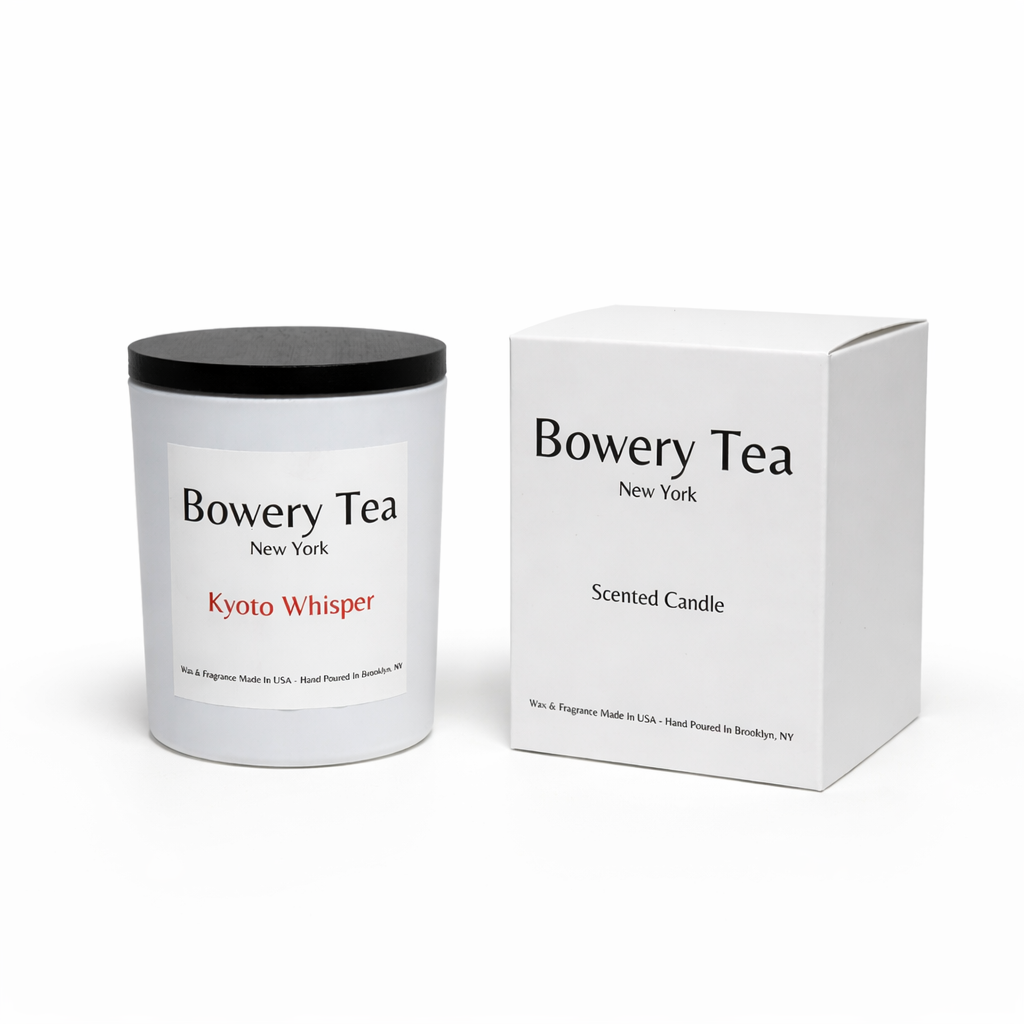 Bowery Tea Kyoty Whisper scented candle in white glass container with black lid and packaging box