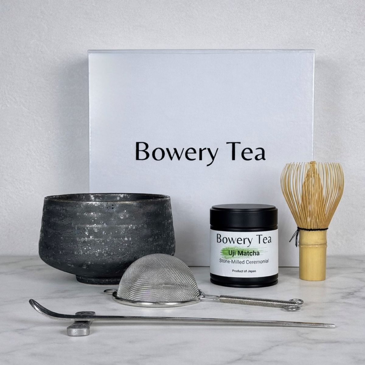 Bowery Tea matcha ceremony set with chawan bowl, bamboo whisk, ceremonial Uji matcha, and tea strainer