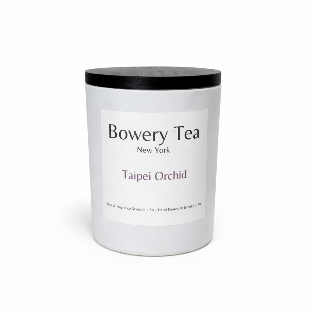 Bowery Tea Taipei Orchid scented candle in white glass jar with black lid