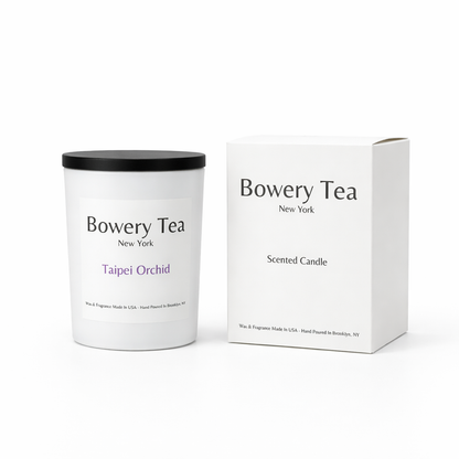 Bowery Tea Taipei Orchid scented candle in white glass container with black lid and packaging box