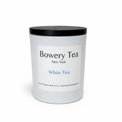 White tea container with black lid and 'Bowery Tea New York' label on a white background