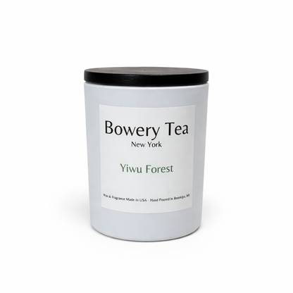Bowery Tea Yiwu Forest scented candle in white glass jar with black lid