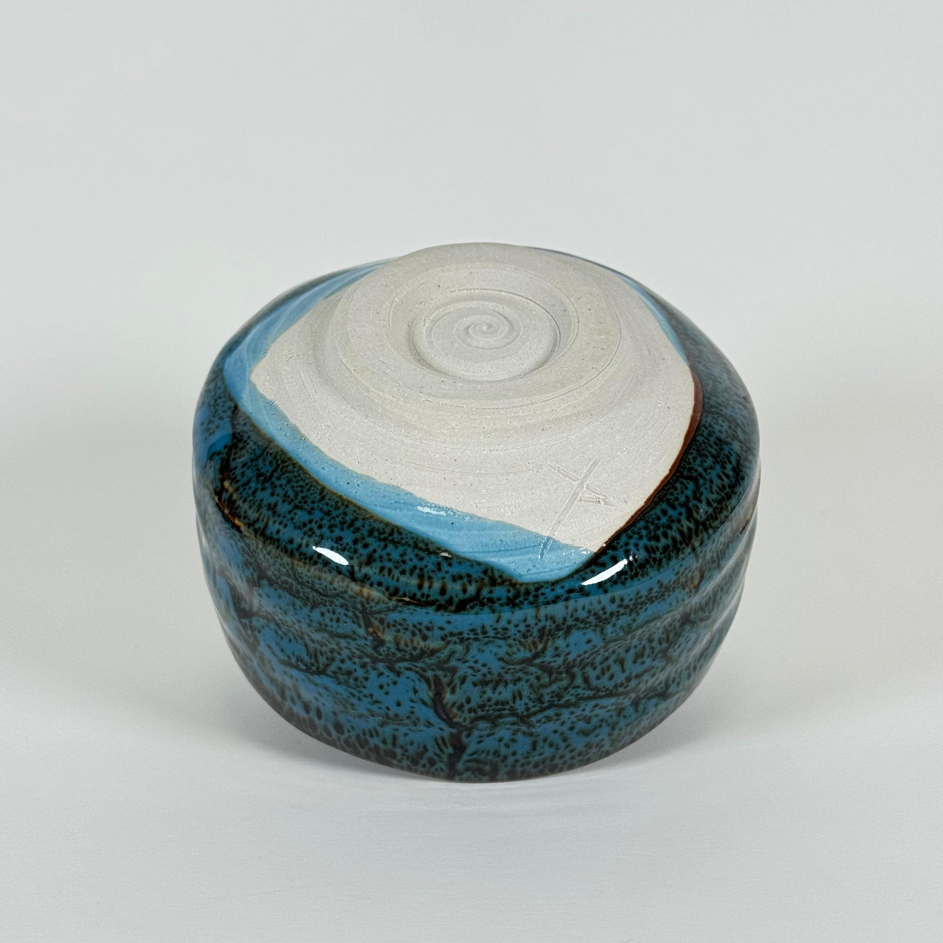 Handmade Japanese blue glazed matcha bowl showing side profile and form