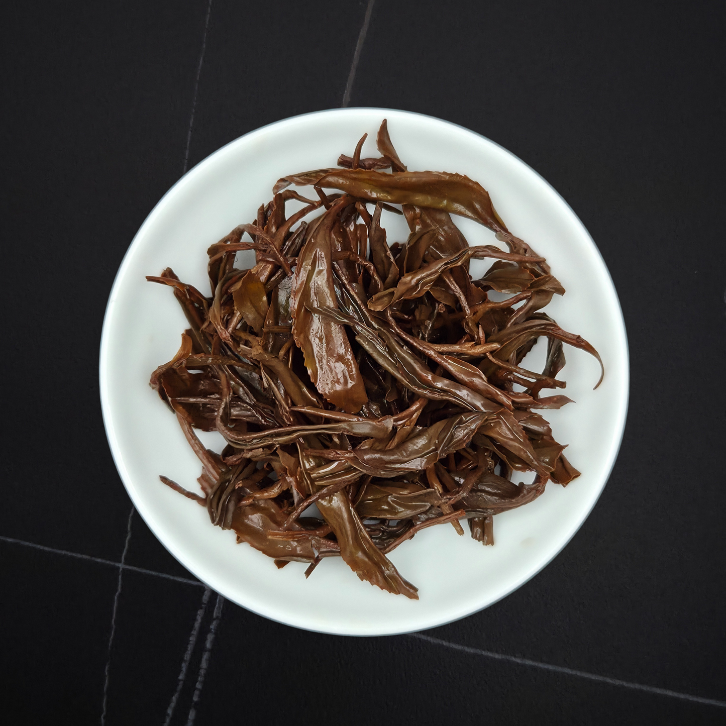 Close-up of China Ai Lao Shan Wild black tea leaves