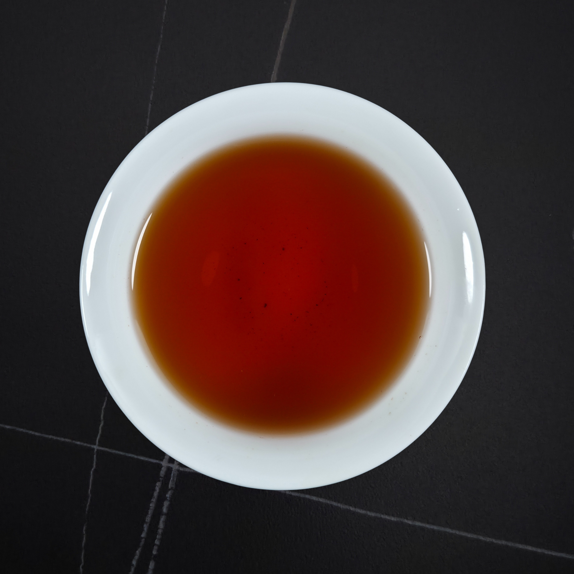 Brewed China Zheng Shan black tea with deep amber liquor