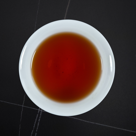 Brewed China Zheng Shan black tea with deep amber liquor