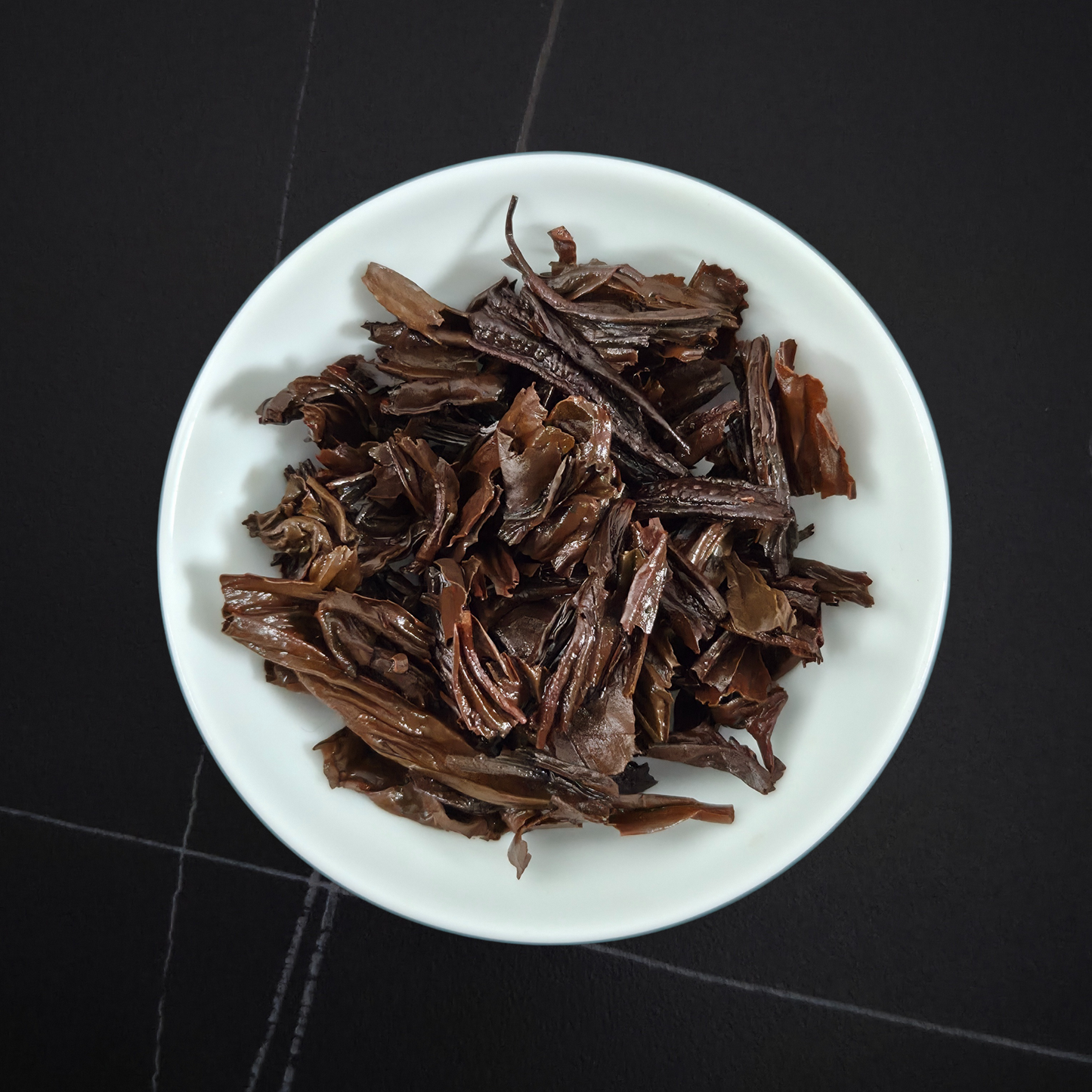 Brewed China Zheng Shan Smoked black tea with dark amber liquor