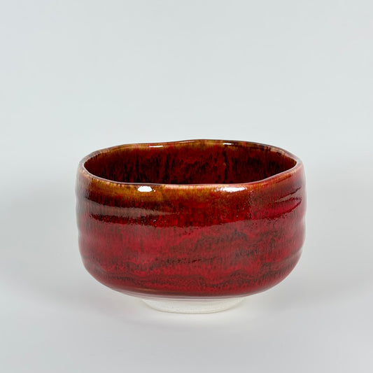 Handmade Japanese matcha bowl with deep red and brown ember glaze ceramic chawan for traditional tea preparation