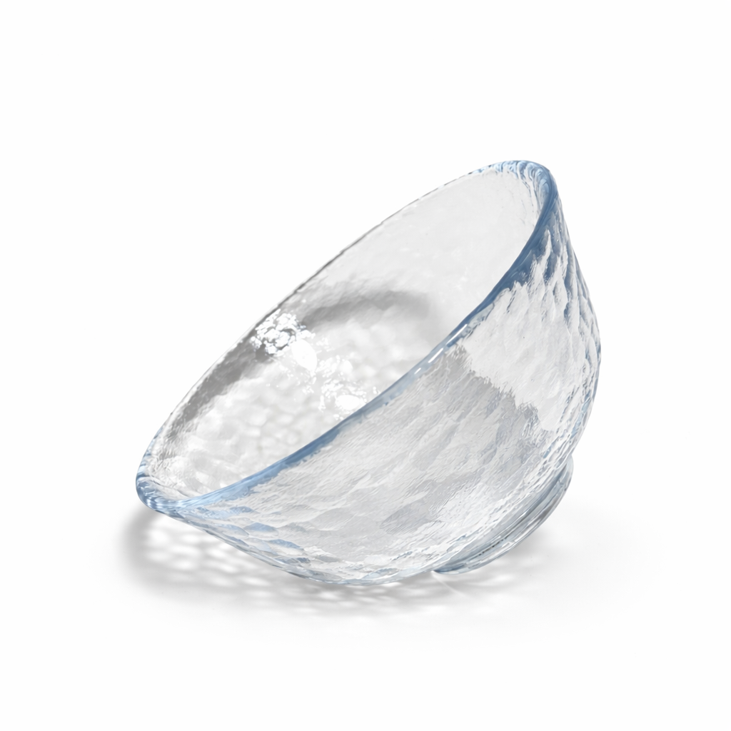 Angled view of clear Edo glass matcha bowl with textured hammered glass