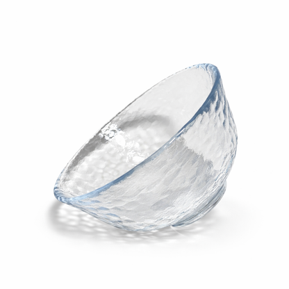 Angled view of clear Edo glass matcha bowl with textured hammered glass