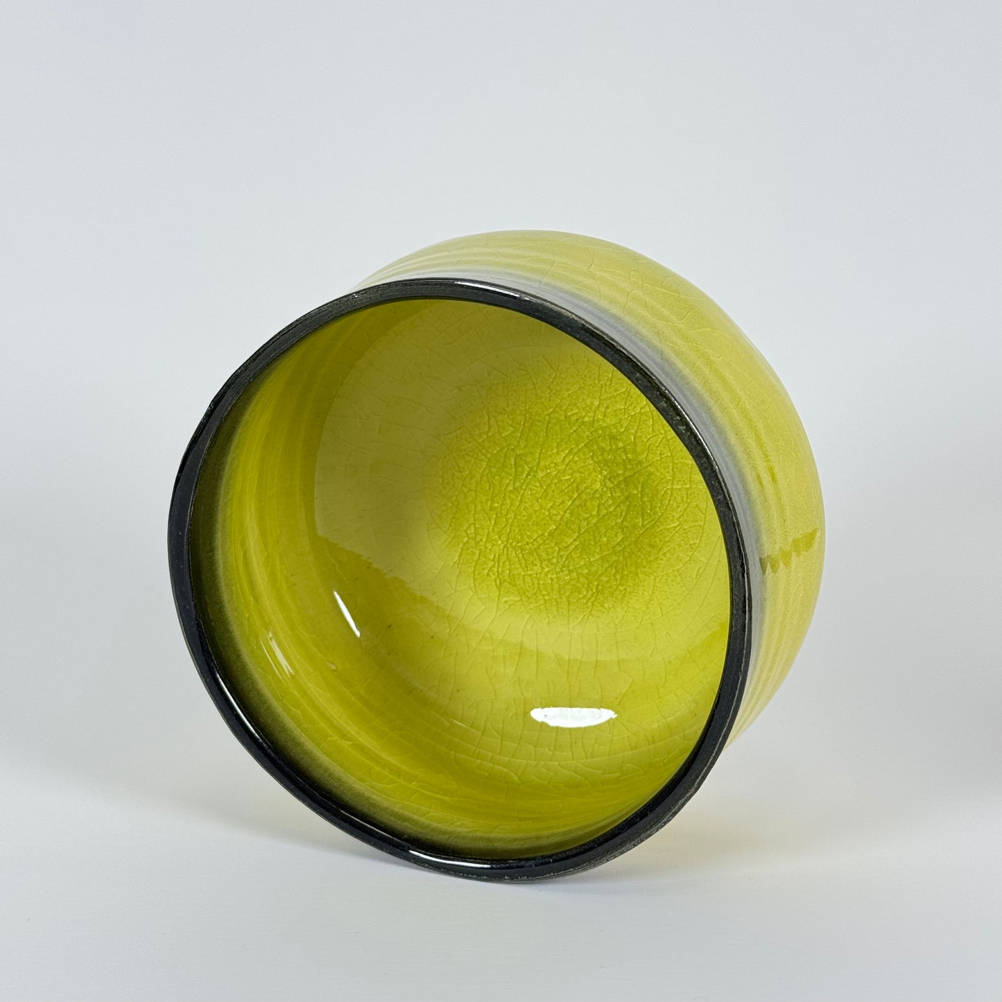 Top view of Golden Dawn Japanese matcha bowl with vibrant yellow interior glaze for whisking matcha