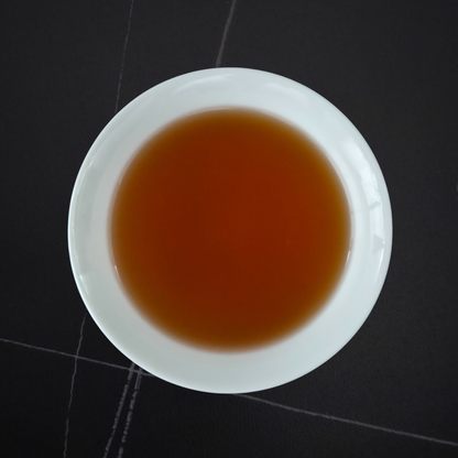Brewed China Ai Lao Shan Wild black tea with amber liquor