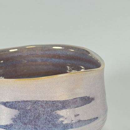 Detail of Pear Mist matcha bowl showing pearlescent glaze and lavender blue banded pattern