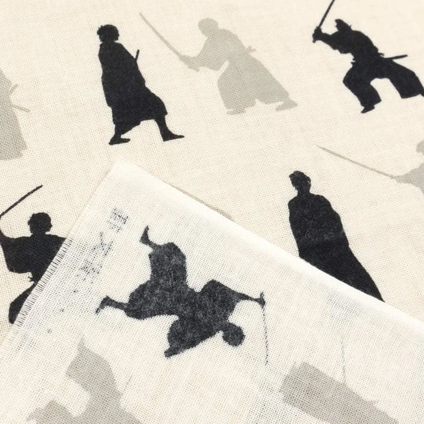 Close-up of samurai motif on Japanese tenugui cotton cloth