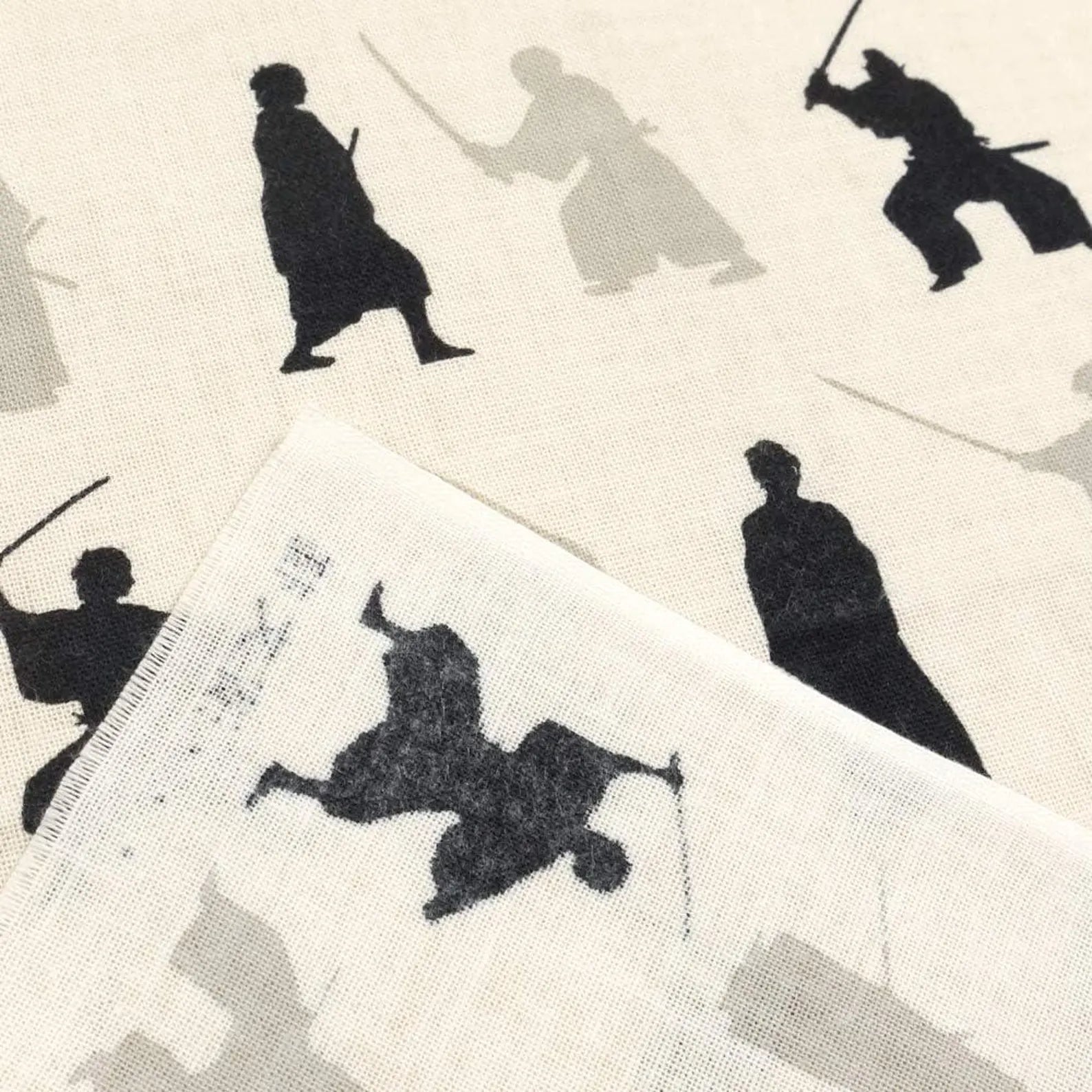 Close-up of samurai motif on Japanese tenugui cotton cloth
